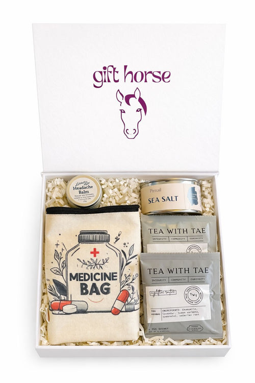 Gift box image: THOROUGHBRED luxury gift box open showing contents including candle, tea and balm
